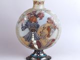 a vase with a picture of a woman on it