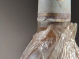 a close up of a bottle of wine on a table