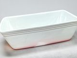 white and red rectangular dish on a table with a white background