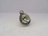 an image of a small glass pendant with a gold chain