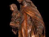 an image of a statue of a woman holding a child
