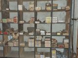a room with a bunch of shelves and boxes on it