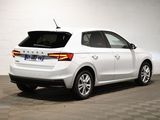 a picture of a white car parked in a garage