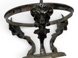 a metal sculpture of a horse on a pedestal