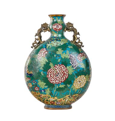 a green vase with flowers on it on a white background