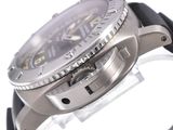 a close up of a watch on a white surface