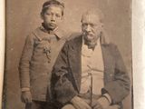 an old photo of two men in military clothing