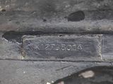a close up of a metal plate with a number on it
