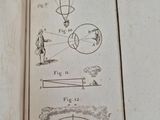 an open book with a drawing of a person on it