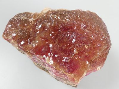 a piece of rock with a pink substance on top of it