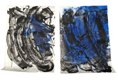 two paintings of blue and black on a white background