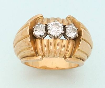 an image of a gold ring with three diamonds on it