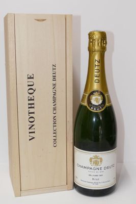 an image of a bottle of champagne next to a wooden box