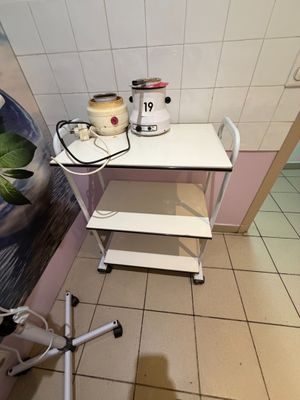 a small table with a mixer on it in a room