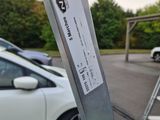 a parking meter attached to a parking meter in a parking lot