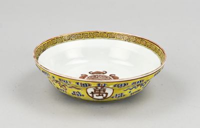 an image of a yellow and white bowl sitting on top of a table