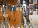 a glass display case with a computer inside of it