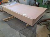 a large pile of wood sitting on a table in a factory
