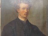 portrait of a man in a black coat and a white collared shirt