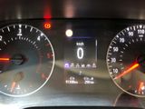 a close up of a car dashboard with various gauges