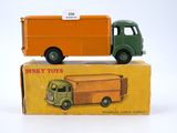 a toy truck that is sitting on top of a box