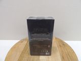 a black box on a wooden table with a white background