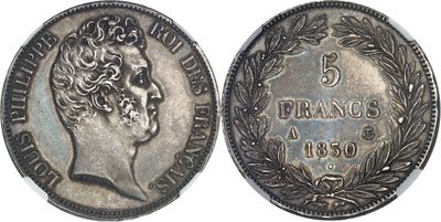 a close up of a silver coin with a crown on it