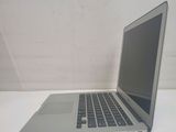 a laptop computer sitting on a table with a white background