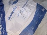 a plastic bag with a blue and white logo on it