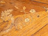 a close up of a wooden table with a clock on it