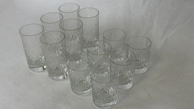 a lot of glasses that are sitting on a table