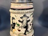 a beer mug with a picture of a pirate on it