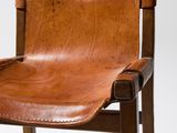 an image of a brown leather chair on a white background