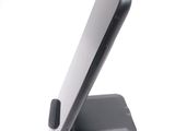 a close up of a cell phone on a stand