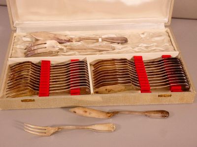 a box of silverware with forks and spoons in it