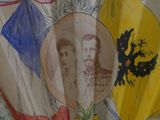 a fan with a picture of two men and a woman on it