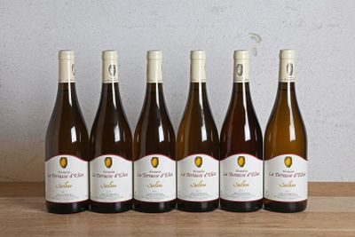 six bottles of wine are lined up in a row on a table
