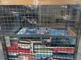 a metal cart with many books on top of it