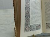 an open book sitting on top of a marble table