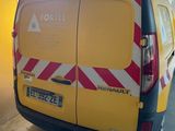 a yellow van that is parked in a garage