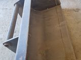 an image of a large metal bucket sitting on the floor