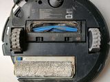an image of a close up of a robot with a toothbrush in it ' s mouth