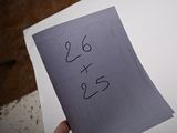 a person holding a piece of paper with the word yes written on it