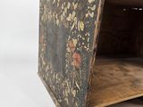 a small wooden box with a floral design on it