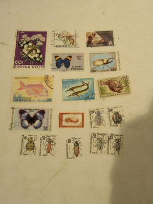 a lot of stamps that are on the table