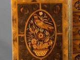 a wooden cabinet with a floral design on it