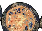four round rugs with floral designs on them on a white surface