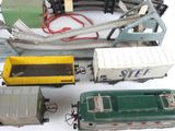 many toy trains that are lined up on a table