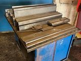 a blue cart with a bunch of wood on it
