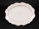 an image of a white plate sitting on top of a black table